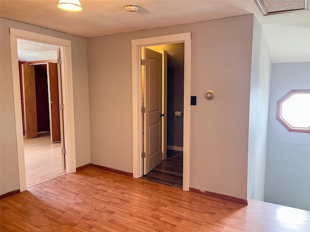 613 Minnesota Ave, Libby, MT 59923 - empty room with a smoke detector and light wood-style floors