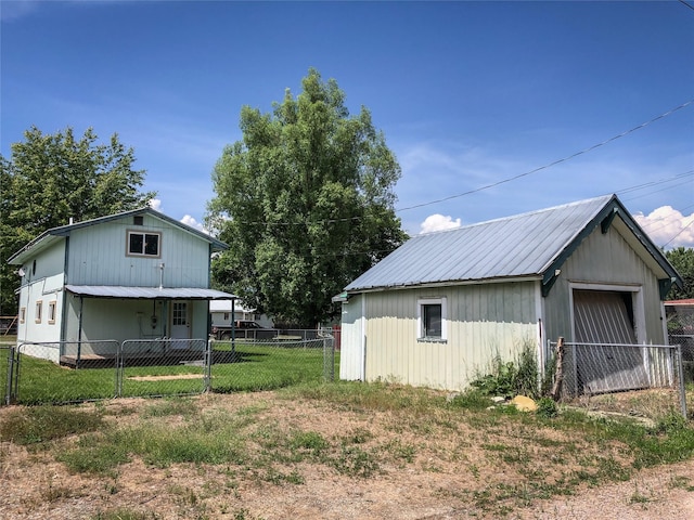 613 Minnesota Ave, Libby, MT 59923 - fenced yard with an outbuilding