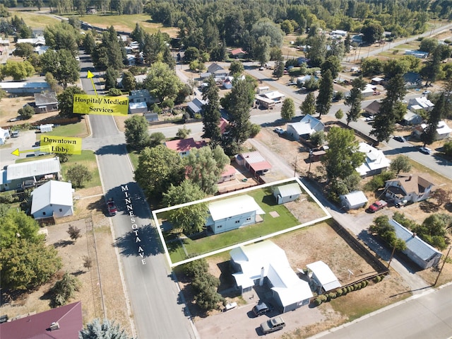 613 Minnesota Ave, Libby, MT 59923 - aerial view of residential area with property boundaries highlighted