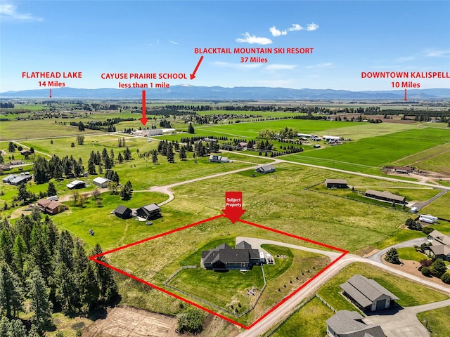 29 Elk Run Trl, Kalispell, MT 59901 - aerial view of sparsely populated area featuring a mountain backdrop and property boundaries highlighted