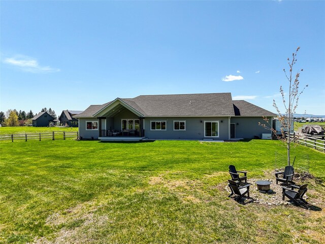 29 Elk Run Trl, Kalispell, MT 59901 - rear view of house with a fire pit