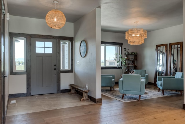 29 Elk Run Trl, Kalispell, MT 59901 - foyer entrance featuring a chandelier, plenty of natural light, wood finished floors, and baseboards