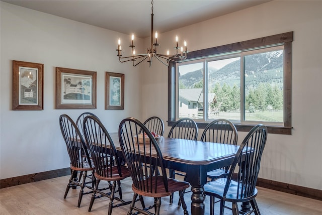 29 Elk Run Trl, Kalispell, MT 59901 - dining area with a chandelier, light wood finished floors, and a mountain view