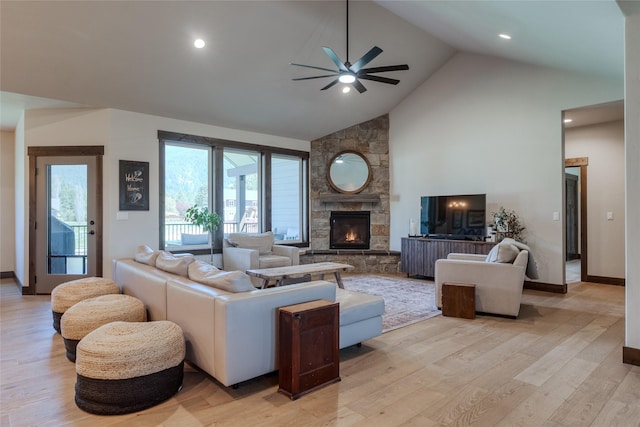 29 Elk Run Trl, Kalispell, MT 59901 - living room with ceiling fan, light wood-style flooring, a fireplace, high vaulted ceiling, and recessed lighting