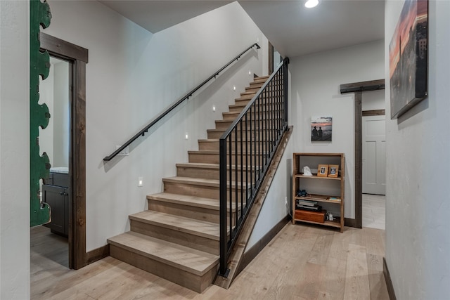 29 Elk Run Trl, Kalispell, MT 59901 - staircase with wood finished floors, a barn door, and recessed lighting