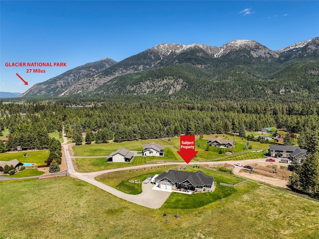 29 Elk Run Trl, Kalispell, MT 59901 - aerial view of mountains and a forest
