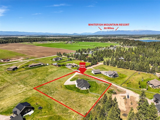 29 Elk Run Trl, Kalispell, MT 59901 - aerial overview of property's location featuring property boundaries highlighted and a water and mountain view