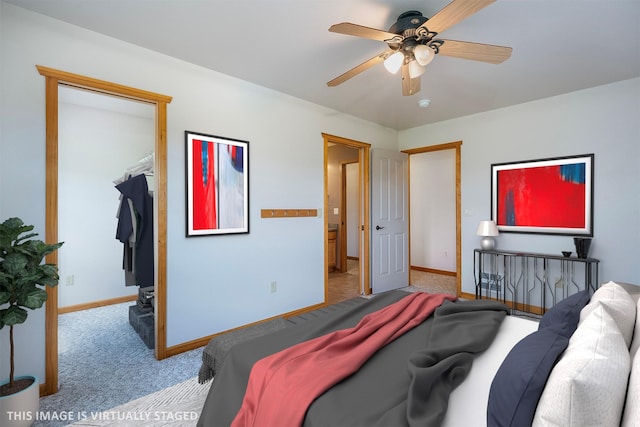 36496 Ridgeway Ct, Polson, MT 59860 - carpeted bedroom featuring baseboards, a walk in closet, and a ceiling fan