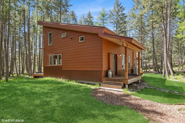 view of home's exterior with a lawn