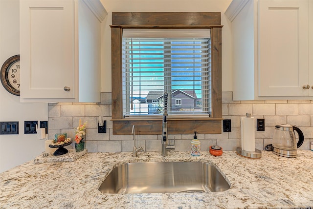 2966 Vermillion Way E, Helena, MT 59635 - kitchen with tasteful backsplash, light stone counters, and white cabinets
