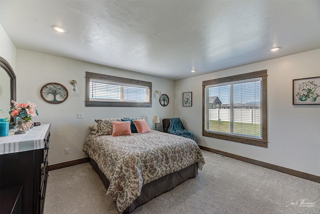 2966 Vermillion Way E, Helena, MT 59635 - bedroom featuring light colored carpet, multiple windows, and recessed lighting