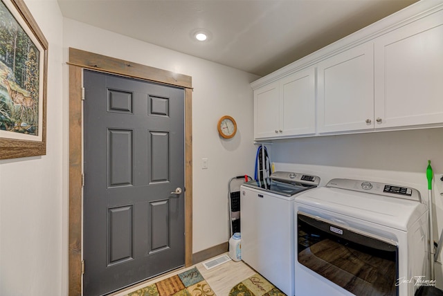 2966 Vermillion Way E, Helena, MT 59635 - laundry area featuring cabinet space, independent washer and dryer, light wood-style floors, and recessed lighting