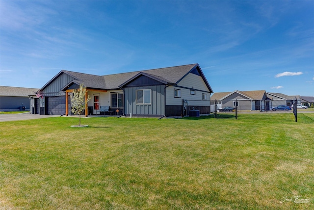 2966 Vermillion Way E, Helena, MT 59635 - view of front of home with board and batten siding, an attached garage, asphalt driveway, and roof with shingles