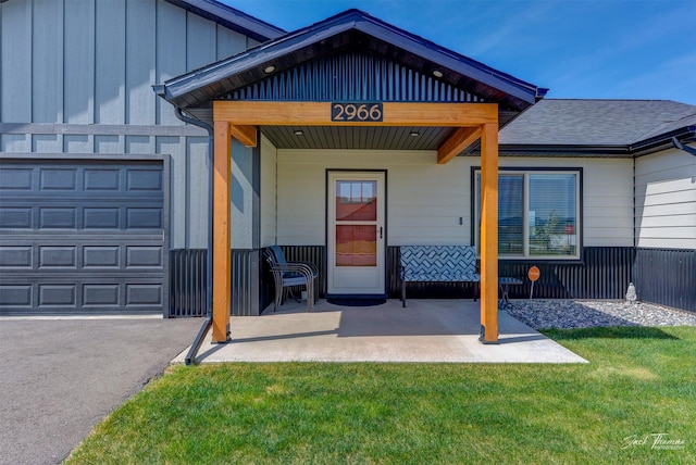 2966 Vermillion Way E, Helena, MT 59635 - entrance to property featuring a yard, a garage, and board and batten siding