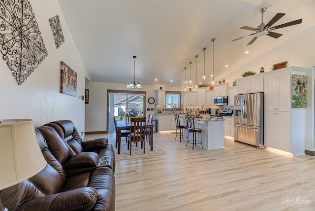 2966 Vermillion Way E, Helena, MT 59635 - living room featuring light wood-type flooring, a ceiling fan, recessed lighting, and high vaulted ceiling