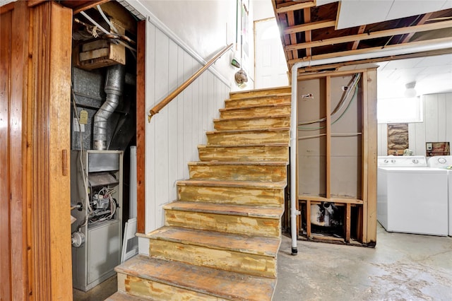 1320 1st Ave S, Great Falls, MT 59401 - stairway with washer and dryer, unfinished concrete floors, and wood walls