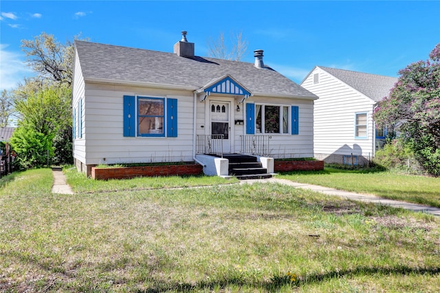 1320 1st Ave S, Great Falls, MT 59401 - bungalow-style house with a front yard, a chimney, and a shingled roof