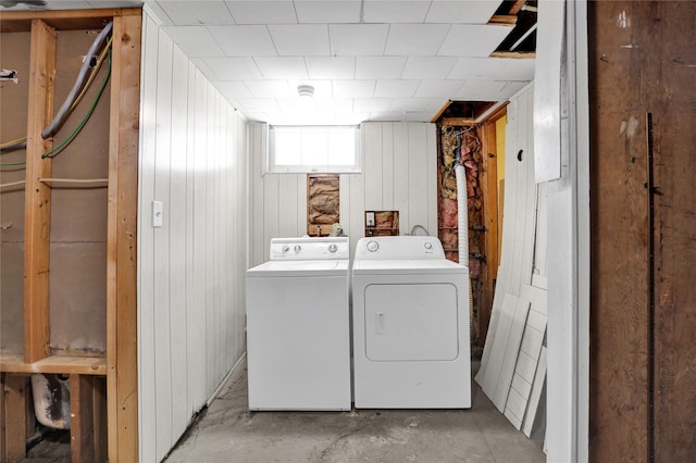 1320 1st Ave S, Great Falls, MT 59401 - washroom featuring separate washer and dryer and wood walls
