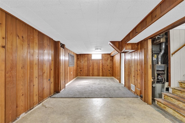 1320 1st Ave S, Great Falls, MT 59401 - below grade area featuring carpet floors, stairs, and wooden walls