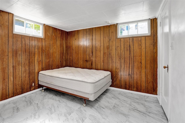 1320 1st Ave S, Great Falls, MT 59401 - bedroom with multiple windows, wood walls, and marble finish floors