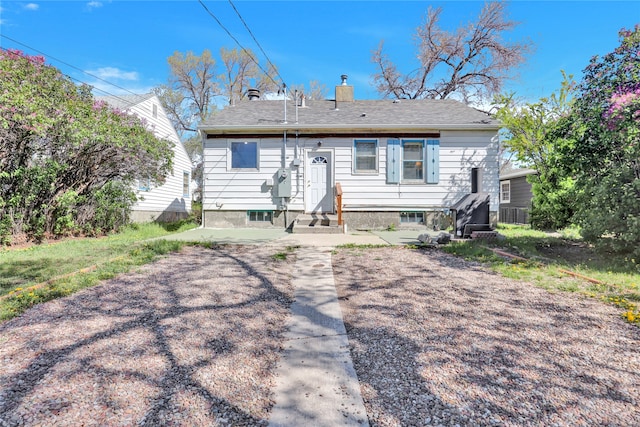 1320 1st Ave S, Great Falls, MT 59401 - rear view of house with a chimney and entry steps