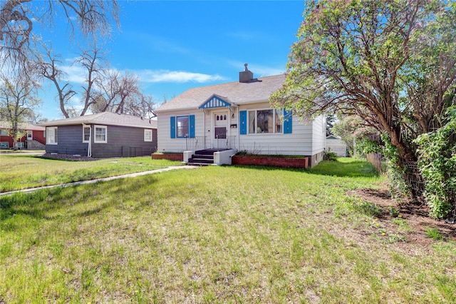 1320 1st Ave S, Great Falls, MT 59401 - bungalow with a front lawn and a chimney