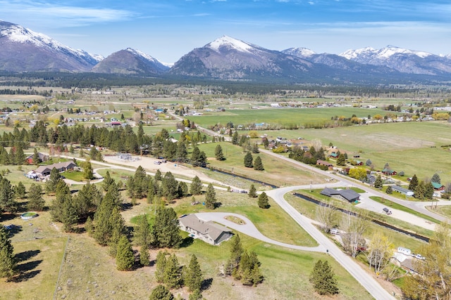 aerial view of property's location featuring a mountainous background