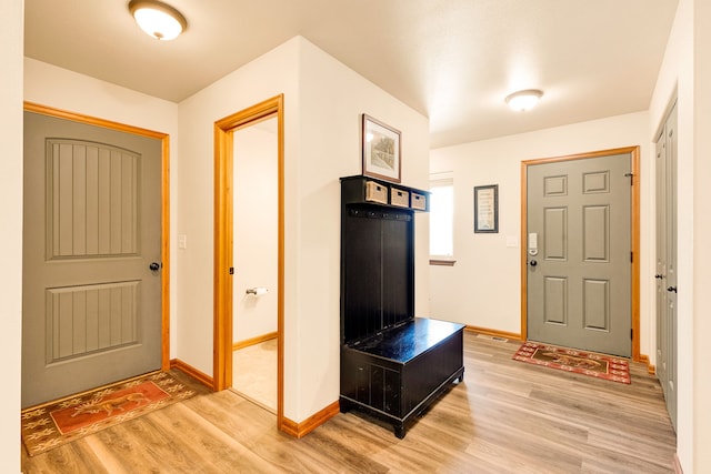 foyer featuring light wood-type flooring and baseboards