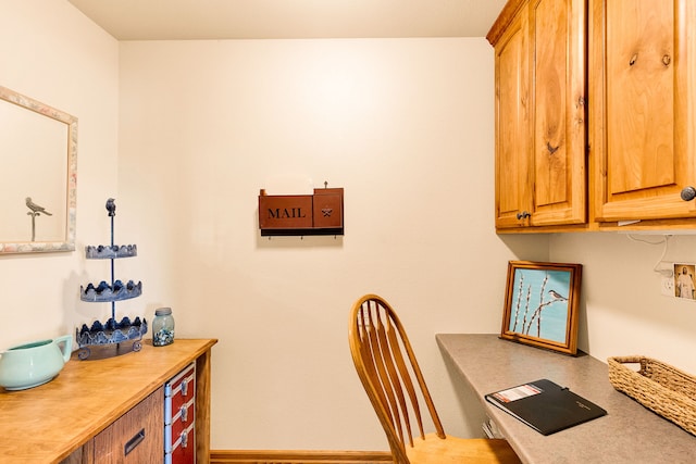 office area featuring baseboards