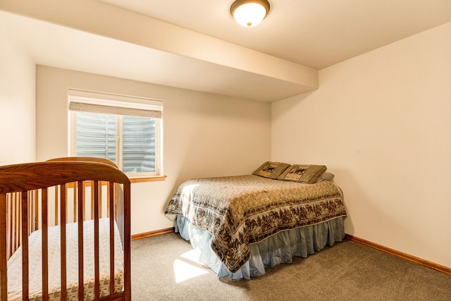bedroom with carpet and baseboards