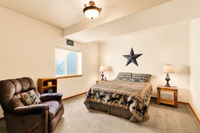 carpeted bedroom featuring baseboards