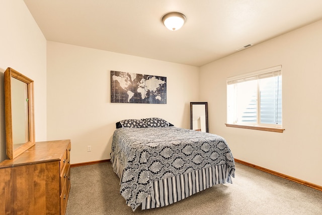 carpeted bedroom with baseboards