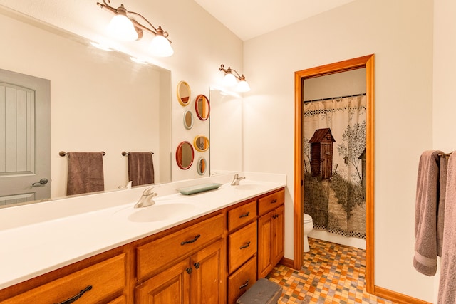 bathroom featuring toilet, double vanity, and curtained shower