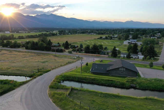 aerial view at dusk of a view of countryside and a water and mountain view