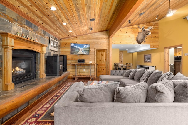 1492 Mcmannamy Draw, Kalispell, MT 59901 - living area with vaulted ceiling, wood finished floors, recessed lighting, wooden ceiling, and wooden walls
