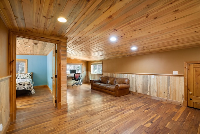 1492 Mcmannamy Draw, Kalispell, MT 59901 - living room featuring wooden ceiling, hardwood / wood-style floors, wainscoting, wooden walls, and recessed lighting