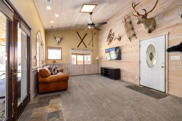 1492 Mcmannamy Draw, Kalispell, MT 59901 - living room with wooden ceiling, wood walls, recessed lighting, wainscoting, and ceiling fan