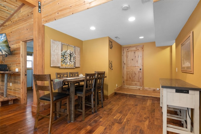 1492 Mcmannamy Draw, Kalispell, MT 59901 - dining room featuring dark wood-type flooring, wooden walls, recessed lighting, and vaulted ceiling