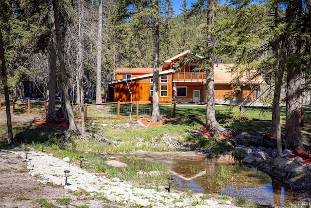 1492 Mcmannamy Draw, Kalispell, MT 59901 - view of yard with a view of trees and a trampoline