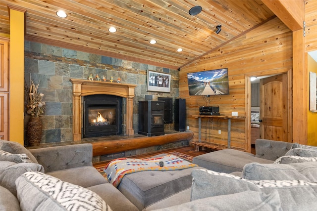 1492 Mcmannamy Draw, Kalispell, MT 59901 - living area with lofted ceiling, recessed lighting, wood ceiling, wooden walls, and a fireplace