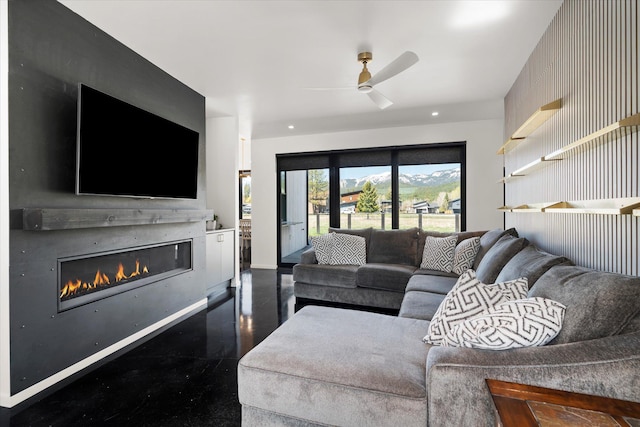 772 Denver St Unit A & B, Whitefish, MT 59937 - living room with a ceiling fan, a glass covered fireplace, and baseboards