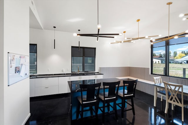 772 Denver St Unit A & B, Whitefish, MT 59937 - dining room featuring wainscoting and a chandelier