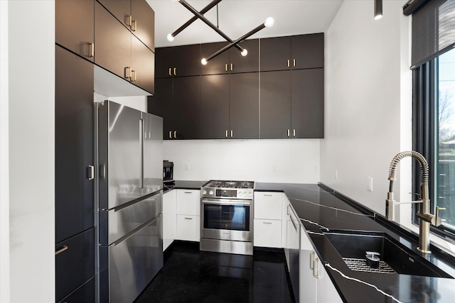 772 Denver St Unit A & B, Whitefish, MT 59937 - kitchen featuring stainless steel appliances, a sink, dark countertops, and white cabinetry