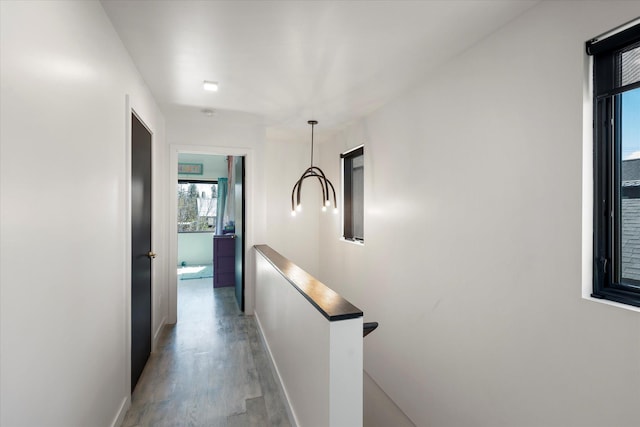 772 Denver St Unit A & B, Whitefish, MT 59937 - corridor with an upstairs landing, light wood-type flooring, and baseboards