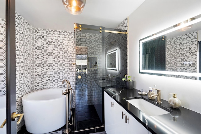 772 Denver St Unit A & B, Whitefish, MT 59937 - full bathroom featuring a tile shower, a soaking tub, and vanity