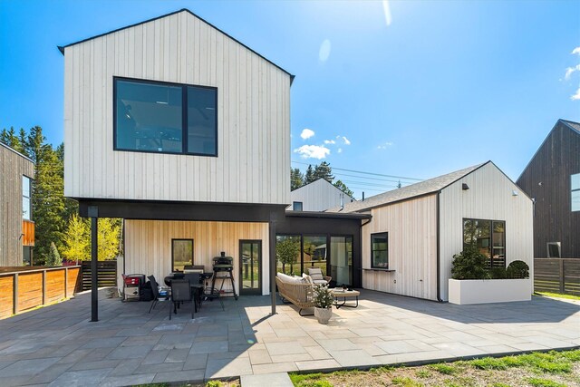 772 Denver St Unit A & B, Whitefish, MT 59937 - rear view of property featuring fence, a patio, and an outdoor living space