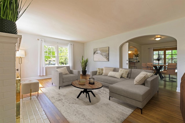 300 Evans Ave, Missoula, MT 59801 - living room with arched walkways, healthy amount of natural light, and wood finished floors