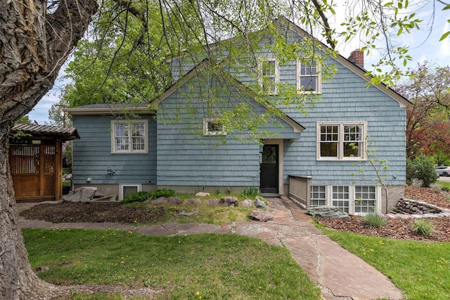 300 Evans Ave, Missoula, MT 59801 - view of front of house with a chimney and a front lawn