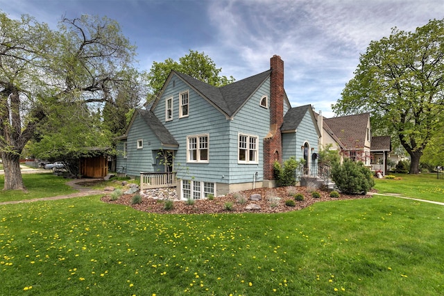 300 Evans Ave, Missoula, MT 59801 - view of side of property with a lawn, a chimney, and roof with shingles