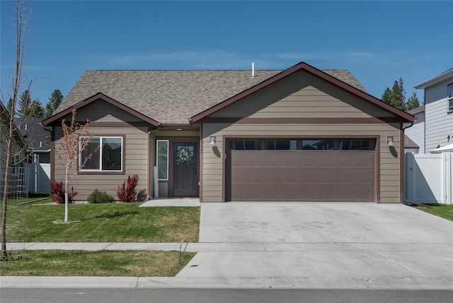 517 Raven Ln, Kalispell, MT 59901 - ranch-style home with a garage, concrete driveway, and roof with shingles